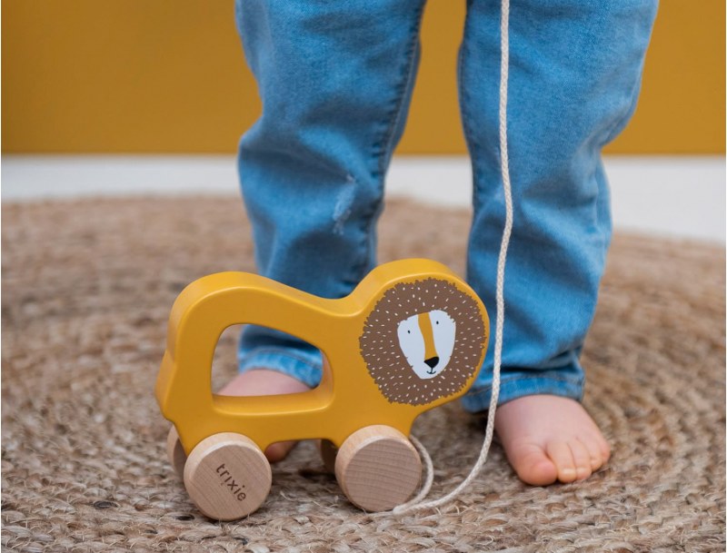 Yellow wooden pull-along toy Mr Lion. The walking companion