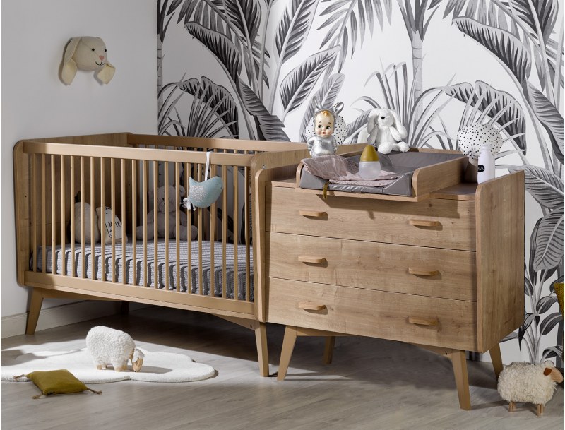 Icône baby room. Convertible baby bed, large dresser and changing table.